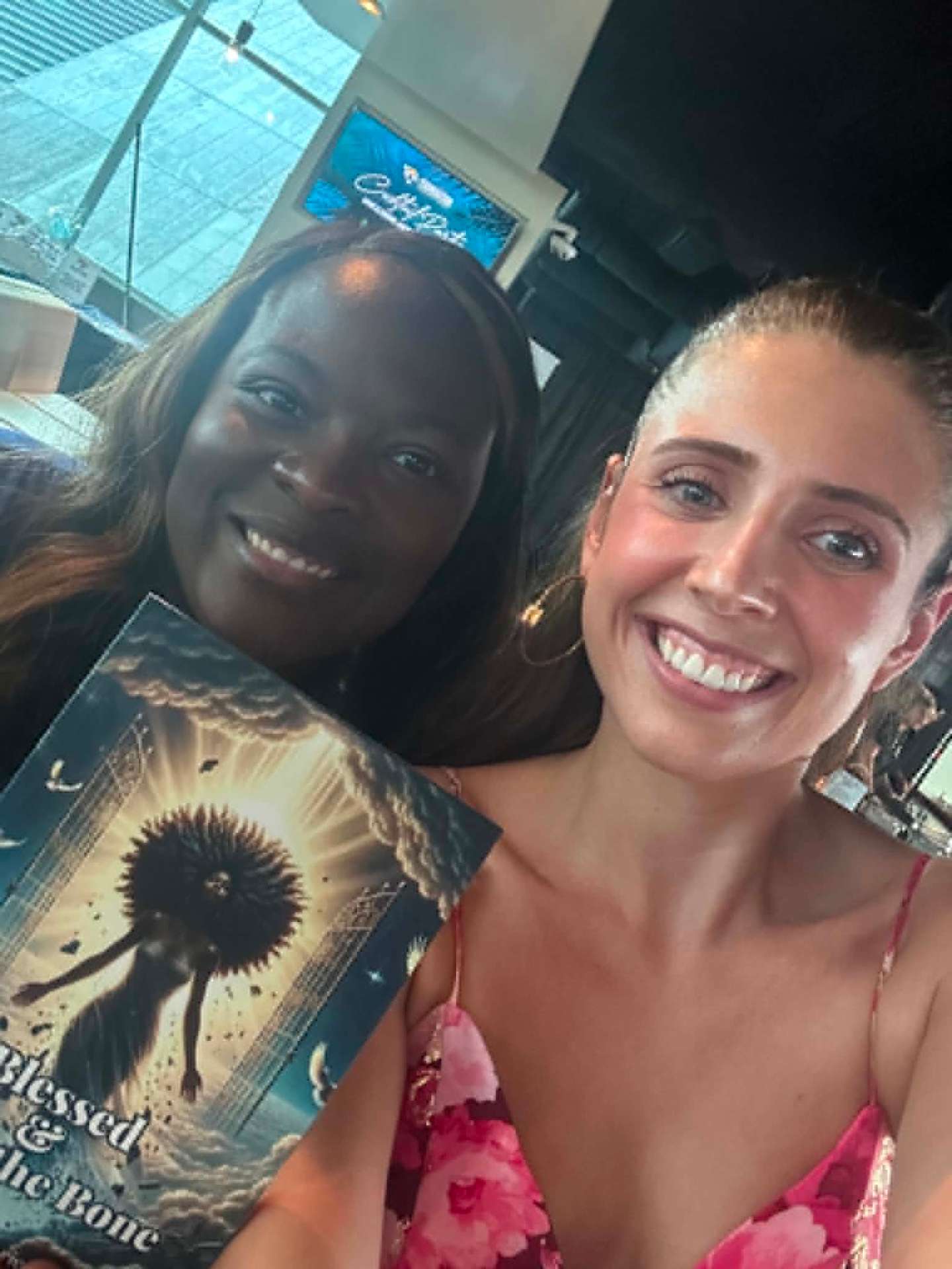 Reader smiling with Blessed and Bad book cover