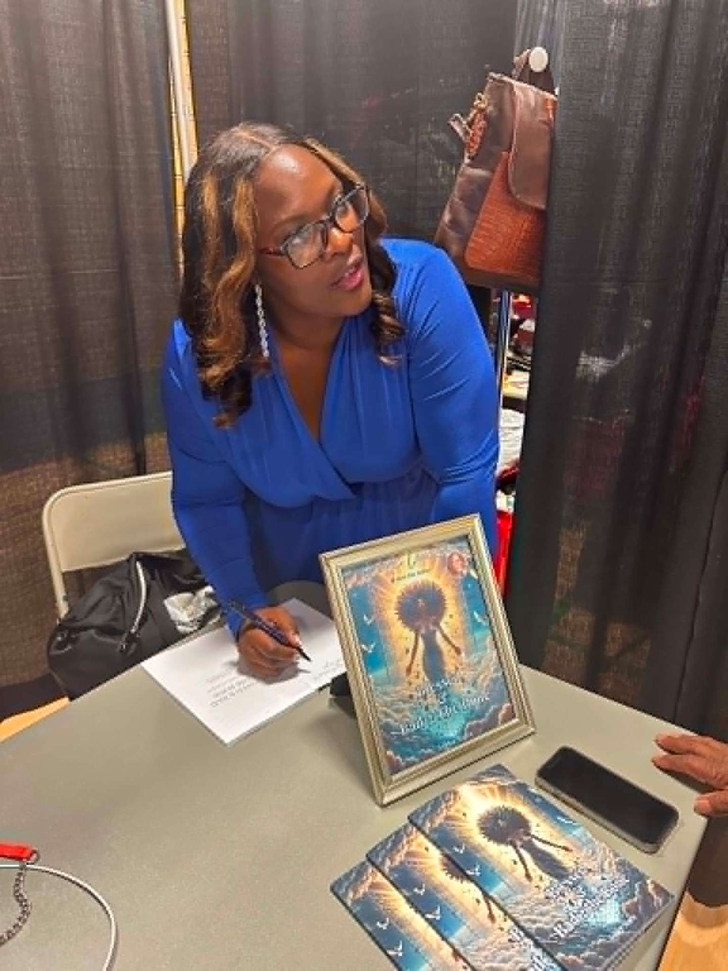 Ashlee Marie signing books at an event